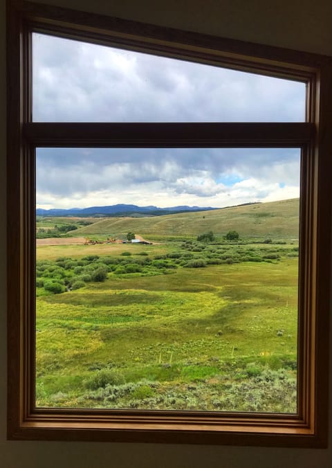 Summer view out the windows.Rocky Mountain National Park peaks in the back!