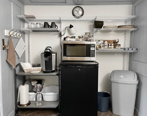 Fridge, microwave, coffee/tea maker, cookware/dishes/utensils