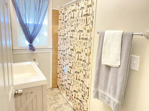 Combined shower/tub, hair dryer, towels, soap