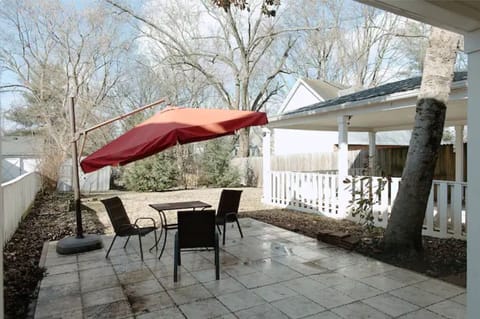 Spacious patio in backyard with fully fenced yard