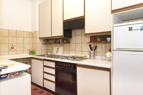 Fridge, oven, dishwasher, dining tables