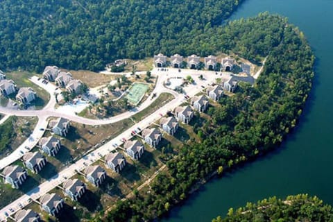 An aerial view which shows that you'll be steps away from the water in a peaceful lakeside community.
