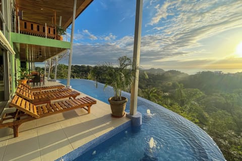 An infinity pool, sun loungers