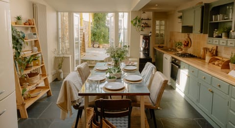 Open plan dining and seating area leading onto a pretty garden.