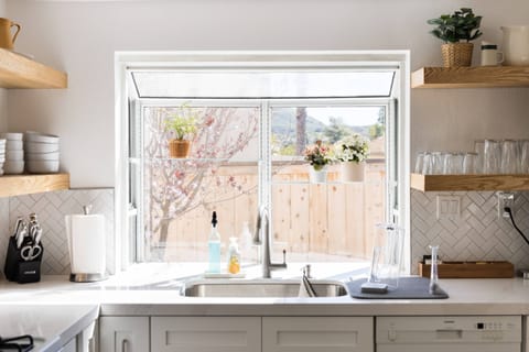 Natural light permeates the kitchen space