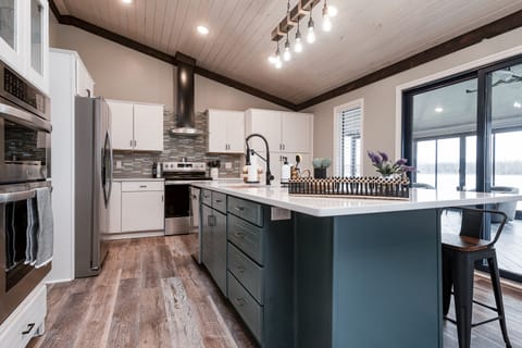 All new gourmet kitchen; double ovens; disposal, 9' island, coffee bar