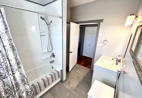 Combined shower/tub, hair dryer, towels, soap