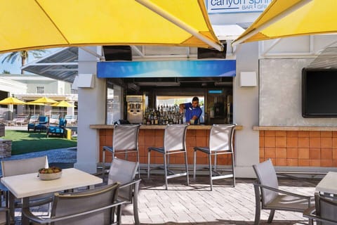 Poolside bar and grill with outside seating available