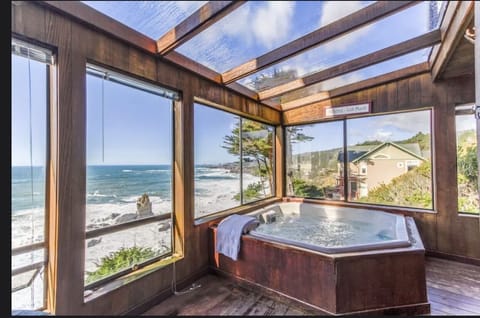 watch the sunset from this indoor hot tub