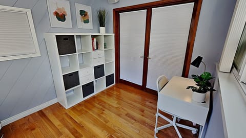 Great dual office space / extra bedroom with twin sized day bed and lots of storage. Beautiful wide glass windows with view.