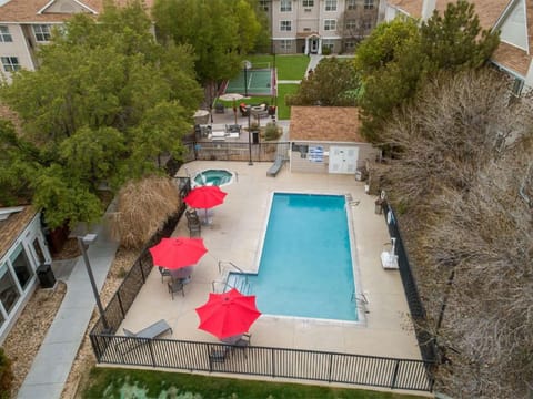Soak up sunshine poolside with loungers and bright umbrellas.