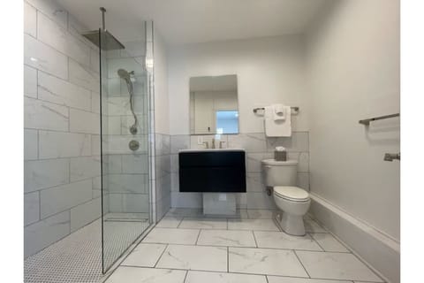 Heated floors, spa-like bathroom with 12" railhead and dual head spray shower