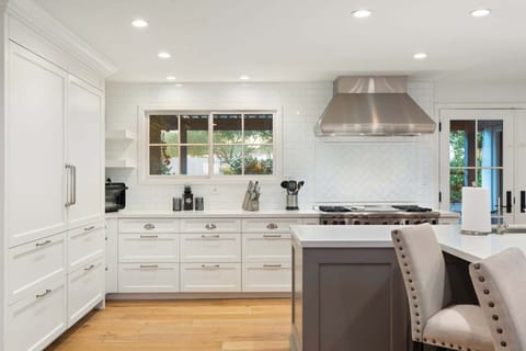 Gourmet chef's kitchen with stainless steel appliances, Sub Zero fridge and Wolf Stove