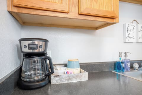 With a coffee maker, filters, and beans ready to brew, all you need is your favorite mug to kickstart your day with a smile!