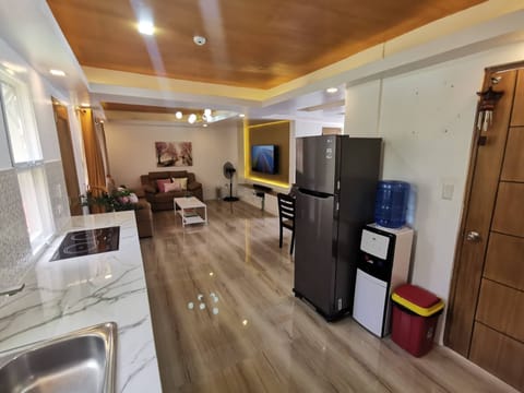 Fridge, microwave, electric kettle, dining tables