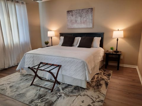 Bedroom with king bed, walk in closet and ensuite bathroom