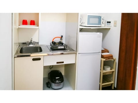 Fridge, microwave, stovetop, cookware/dishes/utensils