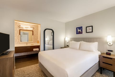 Relax in a serene bedroom with easy access to the vanity.