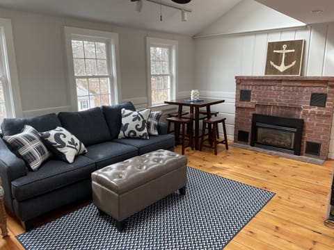 Living room with fireplace, TV is wall mounted just to the right