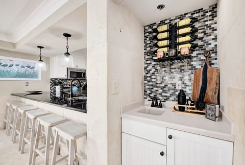 Bar top stools with wine bar.