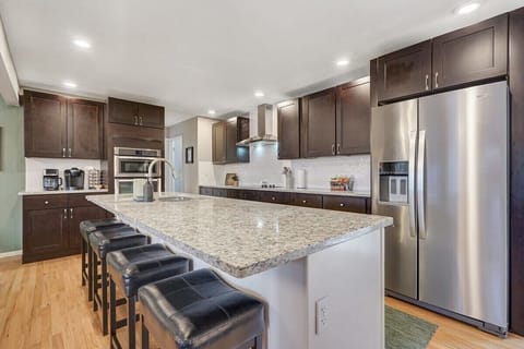 The kitchen that has everything that you need, wonderfully setup for gathering with your loved ones even when cooking!