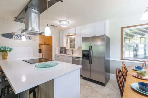 Ample counter space and bar seating for guests to relax and chat while you cook.