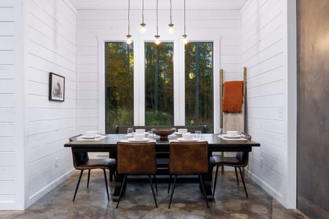 Indulge in 1 of 3 luxurious indoor dining areas where the gorgeous lighting pendants and windows cascade light and nature, creating the perfect atmosphere for memorable dining experiences.