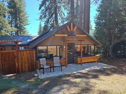 Front view of the house. Cute porch, gate to private serene sitting area.