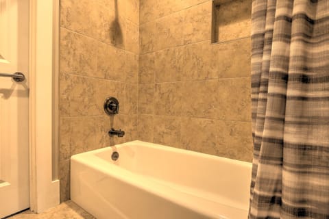 Combined shower/tub, hair dryer, towels, soap