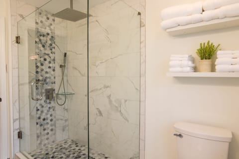 Beautifully updated bathroom.  Rainhood and hand held shower wand.