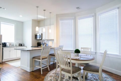 Kitchen and dining area. Seating for 4 at the table and 2 at the counter.