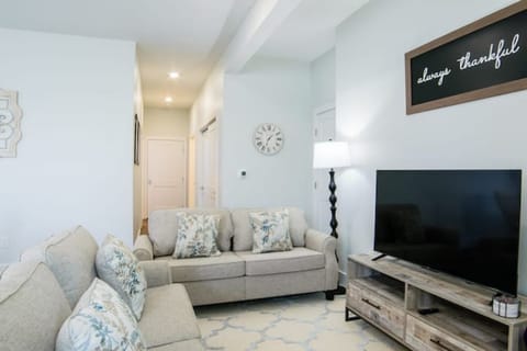 Lovely living area with smart tv and two comfy loveseats.