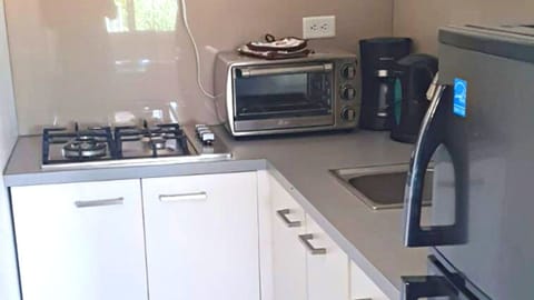 Microwave, coffee/tea maker, toaster, cookware/dishes/utensils