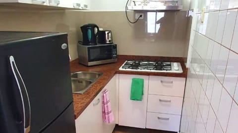 Fridge, microwave, coffee/tea maker, toaster