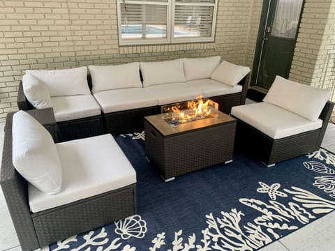 Beautiful patio furniture and fire pit for outdoor gatherings.