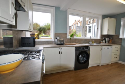 Kitchen which leads out to the rear garden area