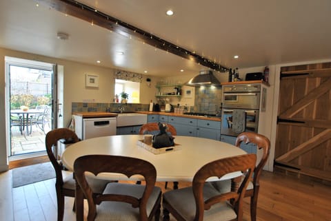 The kitchen provides access to the garden