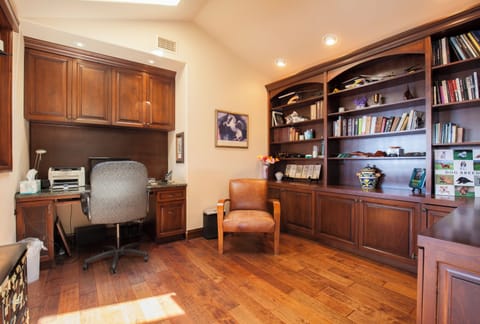 Home office space with library and computer
