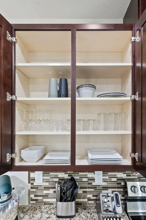 Cheers to easy meals—Hogan Haven’s kitchen is stocked with glasses and dishes, so you can settle in and start livin’ large in Point Venture.