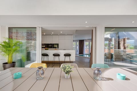 View from the outdoor terrace of the interior of Croatia luxury villa Ideali on Hvar with kitchen and kitchen island