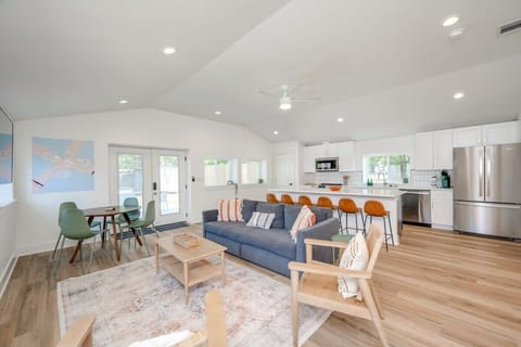 Kitchen large island with seating for 6, and seating for 4 at the back corner, plus seating for 4-10 outside on the patio. Kitchen comes stocked w to make basic meals. Small table to the left makes for a great desk / office / workspace!