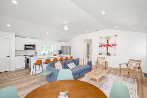 Kitchen large island with seating for 6, and seating for 4 at the back corner, plus seating for 4-10 outside on the patio. Kitchen comes stocked with everything you need to make a basic meal.