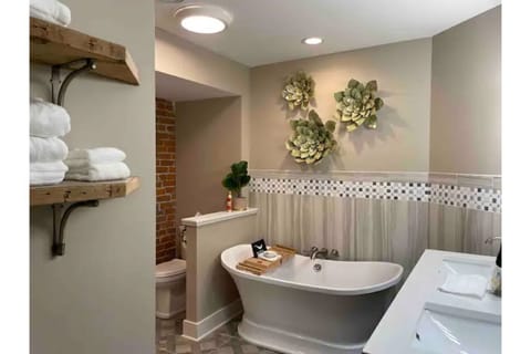 Combined shower/tub, hair dryer, towels, soap