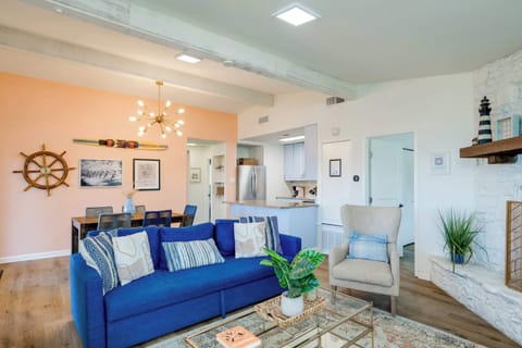 Cozy upstairs living area opens to kitchen bar, dining area. Deck with lake views is off to the left of this picture. 