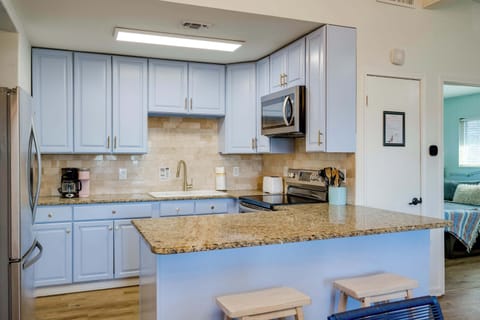 2 bar top seats to kitchen. Stocked kitchen with all the basics to cook meals!