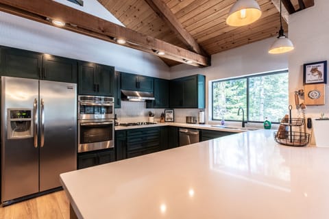 Kitchen with fully equipped gas stove, dishwasher and lots of co