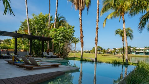 Outdoor pool, a heated pool, sun loungers