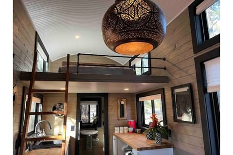 Moroccan pendant light and view of the lofted bedroom.