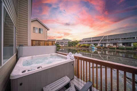 Imagine yourself soaking in the sunsets in the hot tub on the deck suspended over the water! It's the perfect place to unwind and relax after a fun day at the beach. 