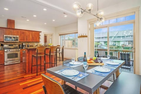 Step into an entertainer's dream kitchen, panoramic water views erase the boundary between you and the breathtaking scenery. Beyond, your very own waterfront deck with a hot tub beckons, promising unforgettable moments of relaxation.